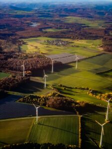 Wind turbines and solar panels in a rural landscape